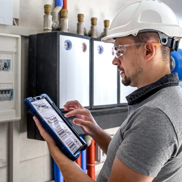 electrical-technician-looking-focused-while-working-switchboard-with-fuses-scaled.jpg electrical-technician-looking-focused-while-working-switchboard-with-fuses-scaled.jpg